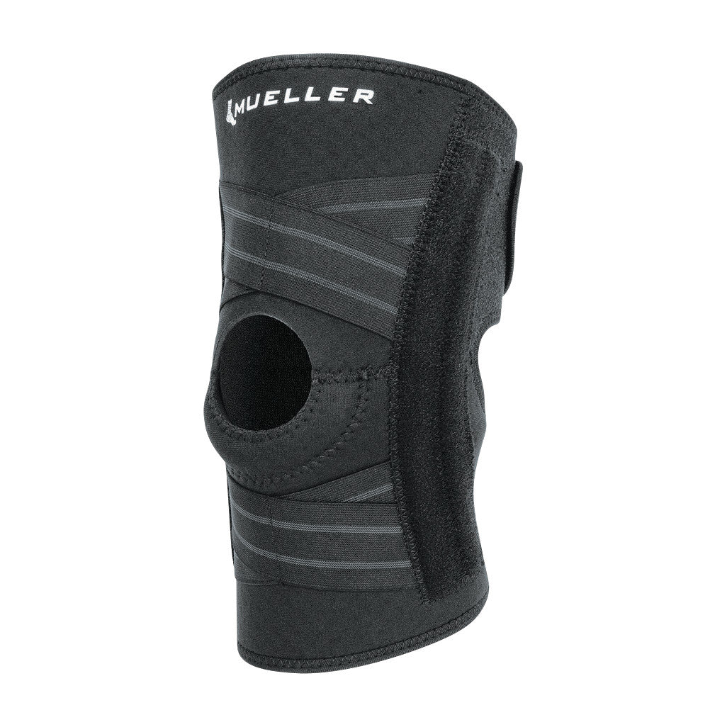 The Mueller Self-Adjusting Knee Stabilizer is a black brace with adjustable straps and a circular kneecap opening for support.