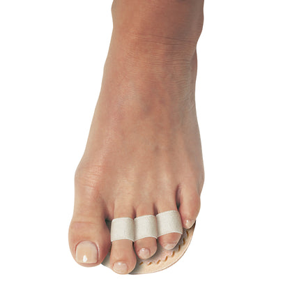 A foot wearing the PediFix Toe Straightener, with three toes wrapped in fabric bands for alignment support.