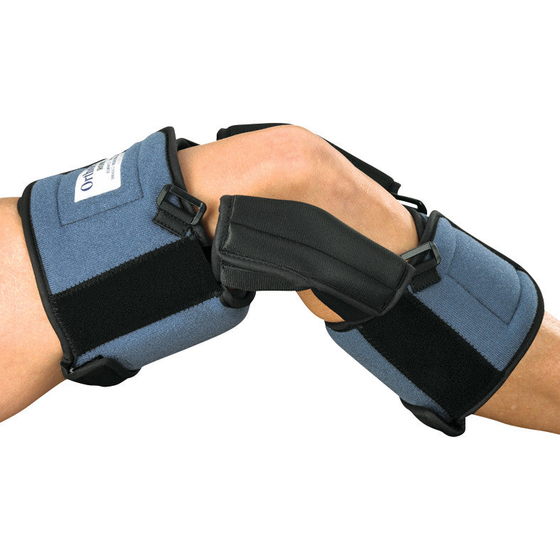A person wears the OCSI OrthoPro ROM Knee Orthosis with blue and black straps, supporting and stabilizing the knee joint.