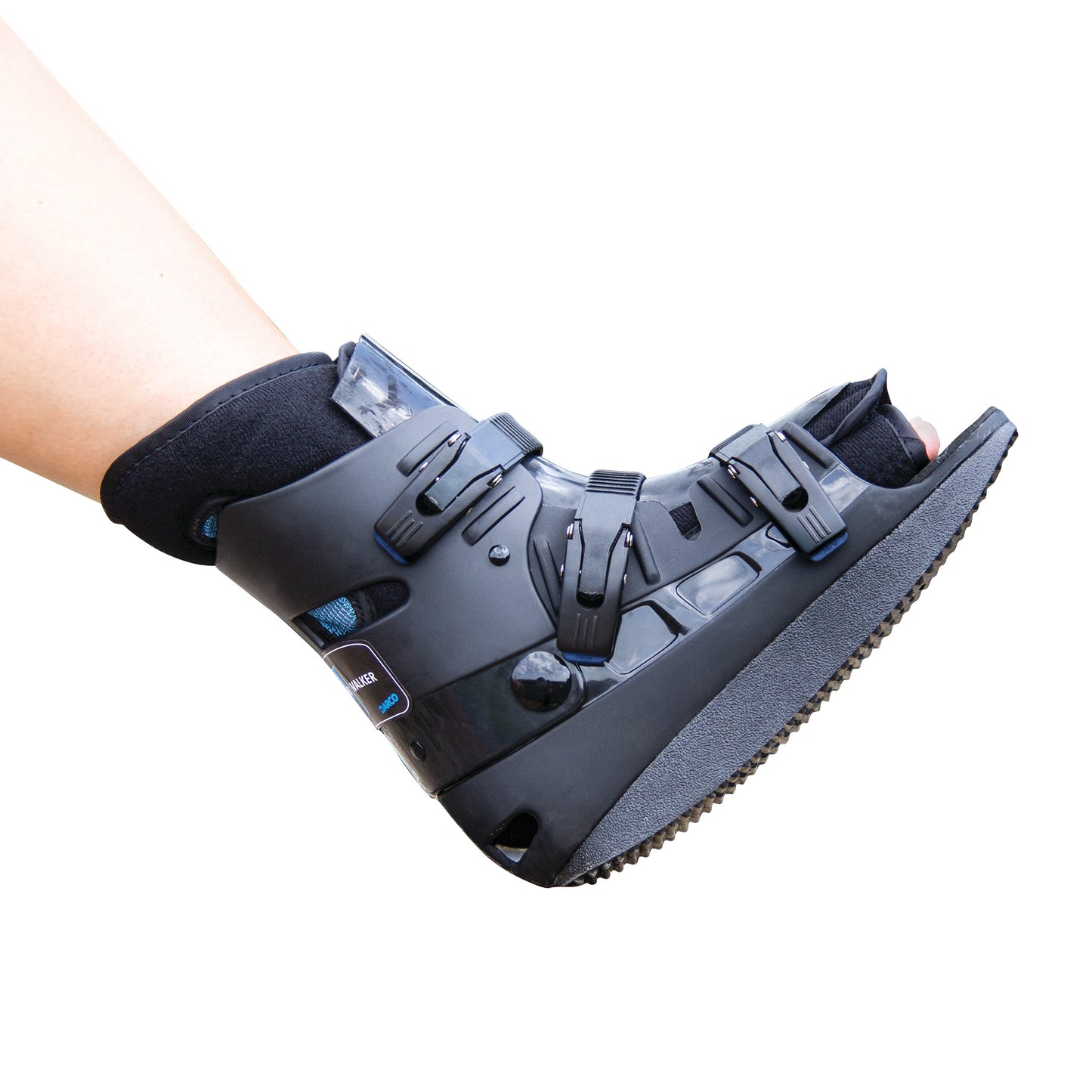 A person's lower leg and foot in a DARCO Body Armor Low Walker orthopedic boot, featuring adjustable straps and a sturdy sole.