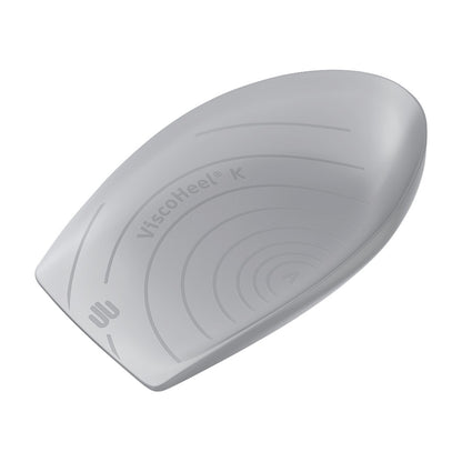 A gray Bauerfeind ViscoHeel K Heel Cushion with grooves is shown from the top view, displaying its curved, contoured design.