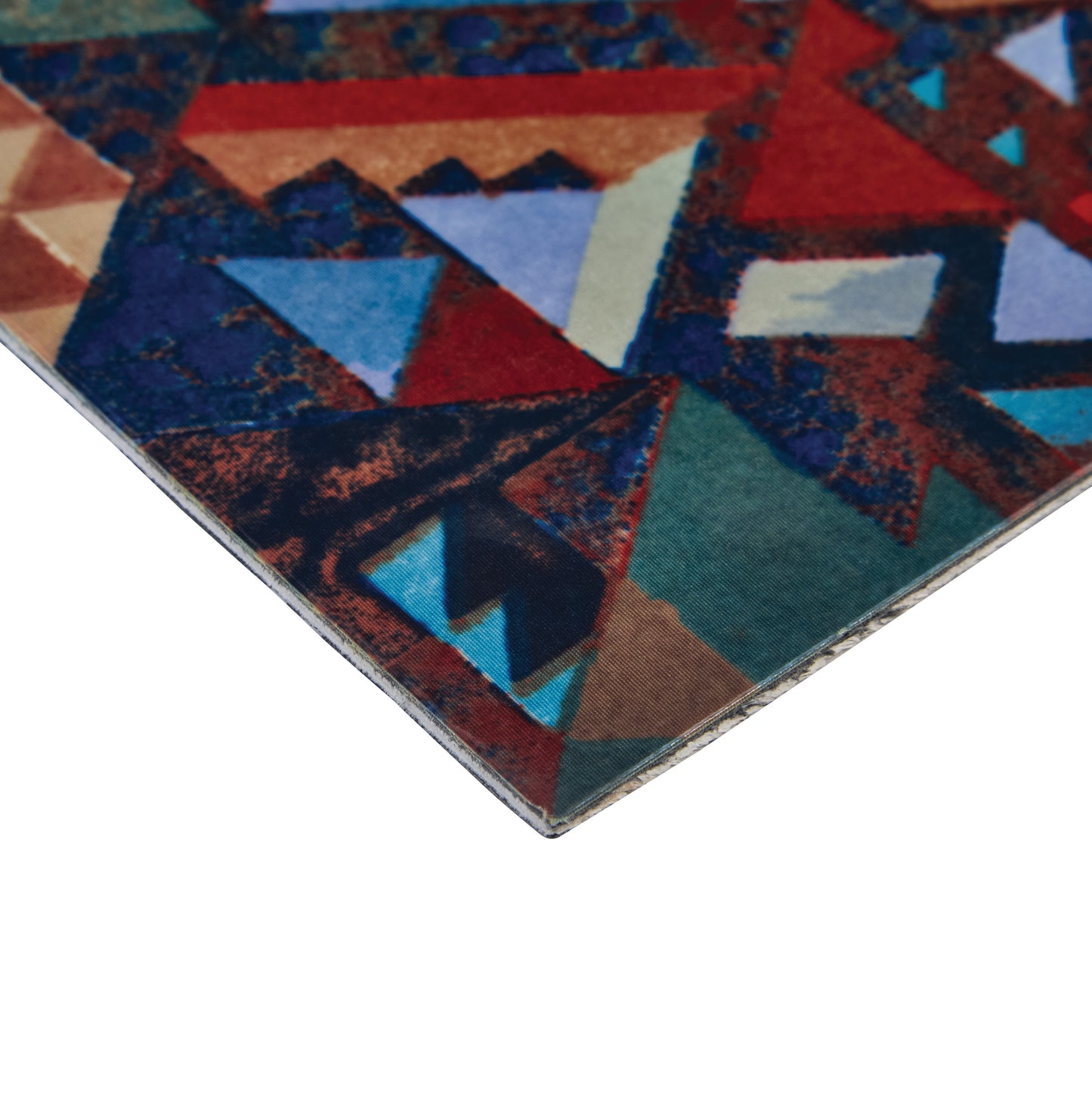 Close-up of an Aetrex Carboplast Composite Sheet, showing a colorful, geometric pattern with triangles and various shades.