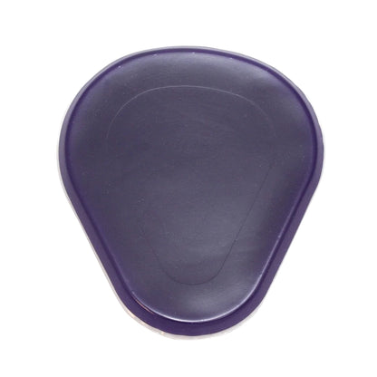 The Gel Ball-of-Foot Met Pad is a purple, teardrop-shaped cushion designed for foot comfort and support.