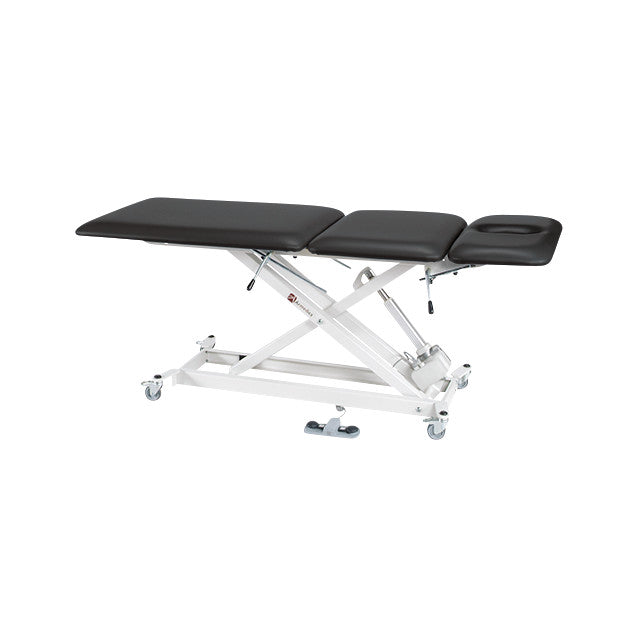 The Armedica Treatment Table with an adjustable black padded surface with a face cutout and a white metal frame with wheels.
