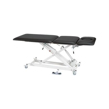 The Armedica Treatment Table with an adjustable black padded surface with a face cutout and a white metal frame with wheels.