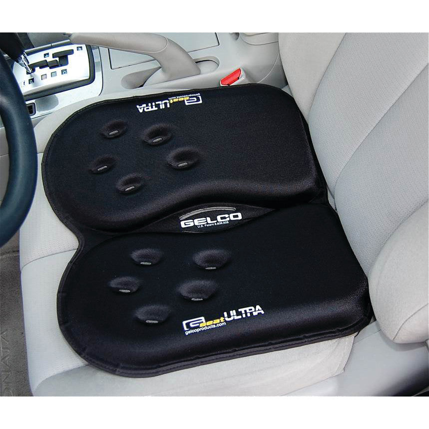 A Gelco GSeat Ultra Portable Gel Seat with a black cushion is placed on a light gray car seat for added comfort.