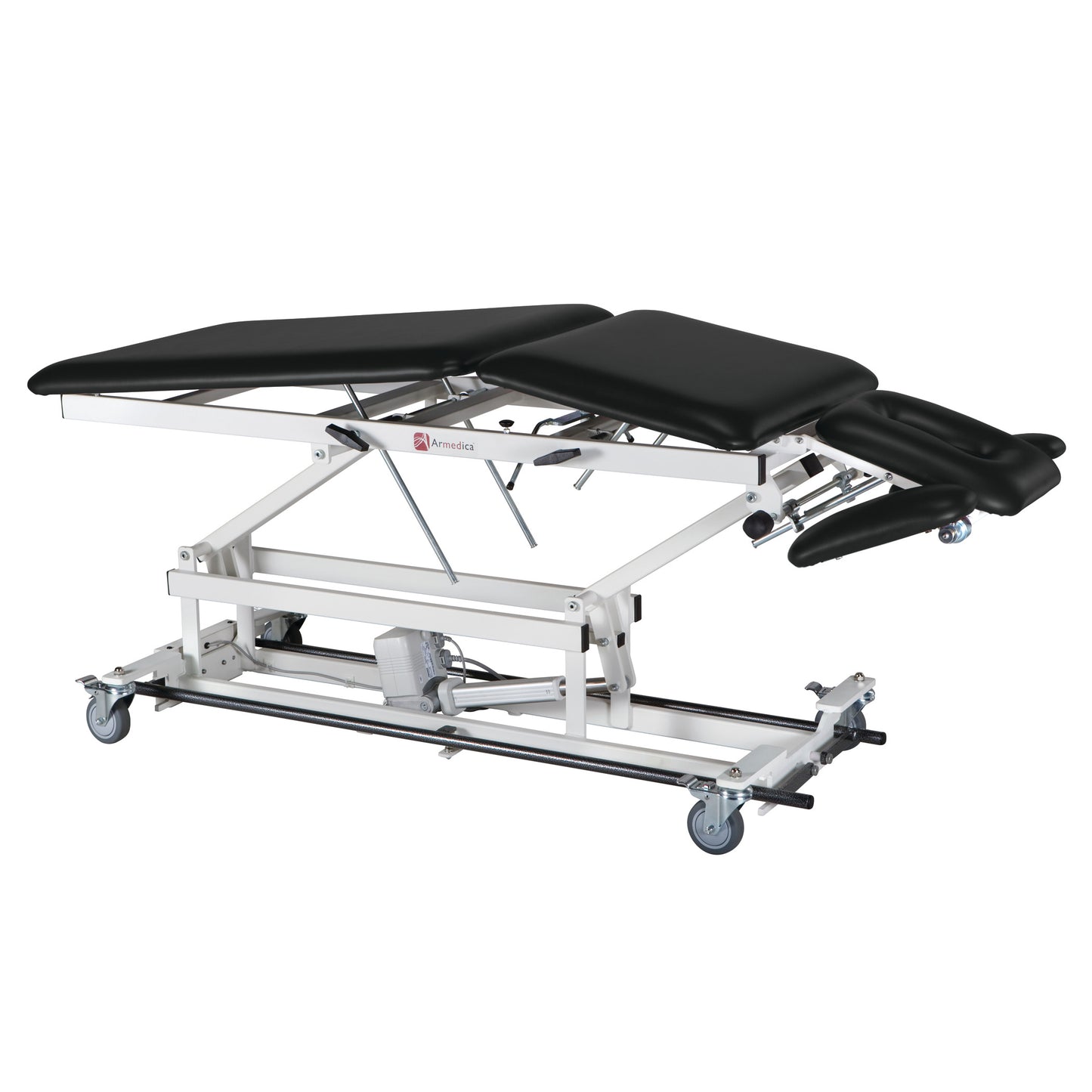 The Armedica AM-BA500 Treatment Table has a black cushioned surface, adjustable sections, and white metal frame with mounted wheels.