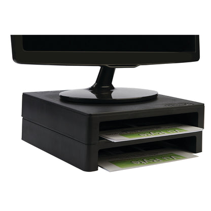 A black VuRyser 2 Monitor Riser elevates a monitor, with two storage slots holding paper.