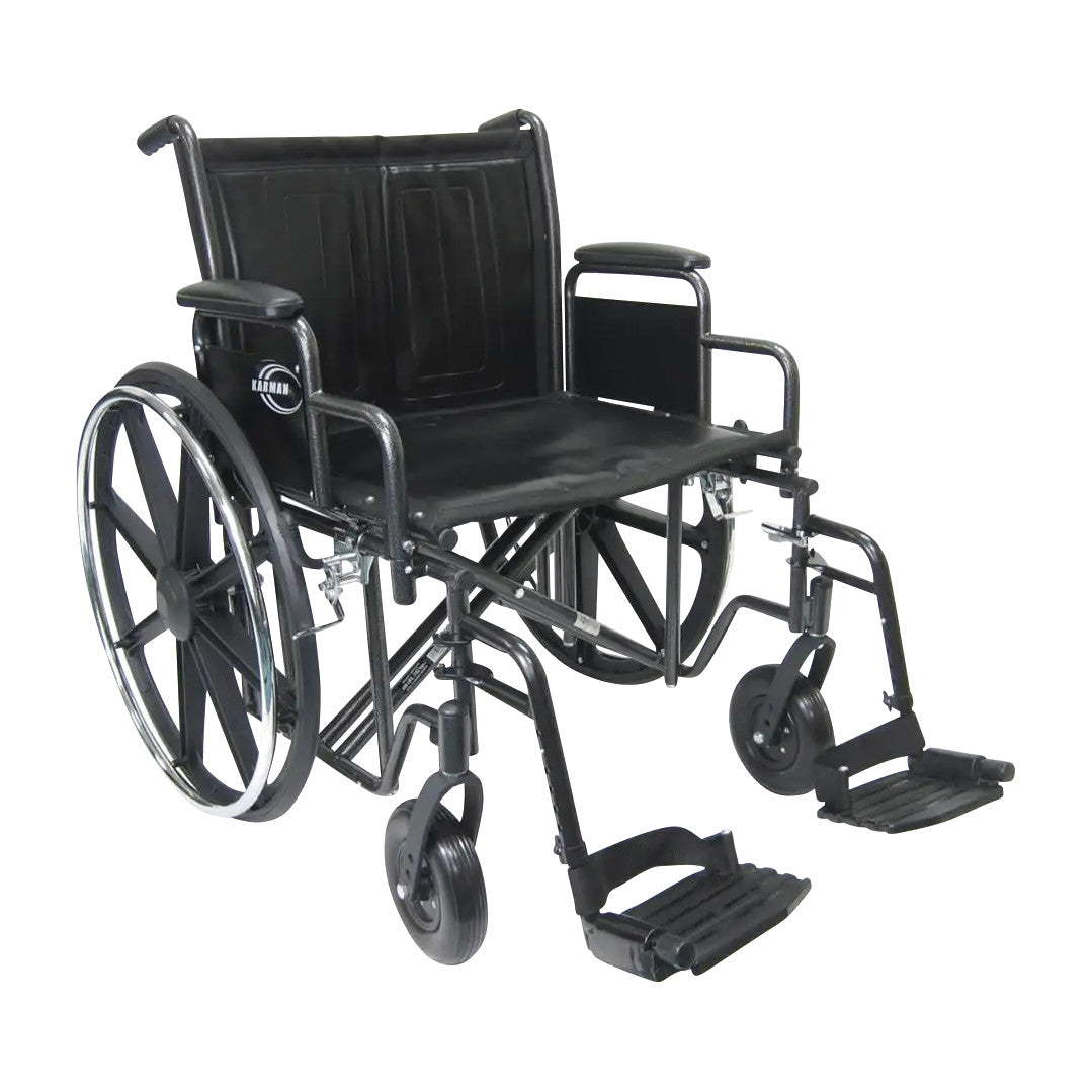 The Karman Bariatric Wheelchair is black with a heavy-duty frame, large rear wheels, and adjustable footrests, designed for comfort.