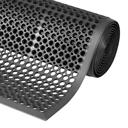 A rolled-up black Sanitop Drainage Anti-Fatigue Mat with a pattern of circular holes for drainage and cushioning.