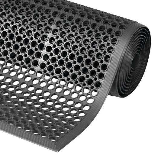 A rolled-up black Sanitop Drainage Anti-Fatigue Mat with a pattern of circular holes for drainage and cushioning.
