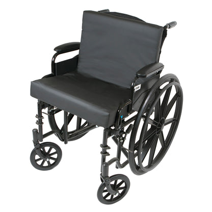 A wheelchair with large rear wheels and a Protekt Seat and Back Combo Wheelchair Cushion for added comfort and support.
