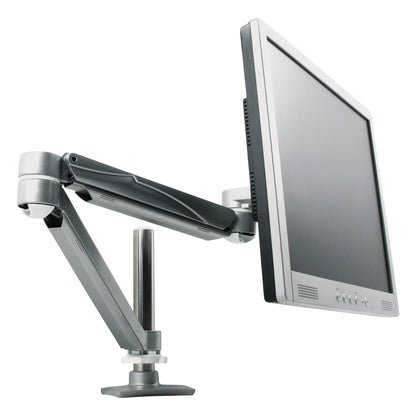 The VersaTech Monitor Arm supports a flat-screen monitor, displaying its flexibility and adjustable height positioning.
