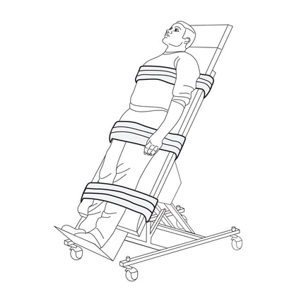 A person is secured on a tilt table using AliMed Tilt Table Straps around the chest, waist, and legs, with the table inclined.