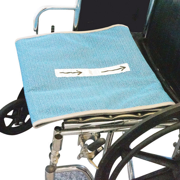 Sit-Rite wheelchair positioning cushion with blue fabric and an arrow label on the seat, attached to the wheelchair frame.