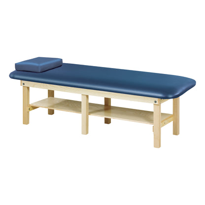 Clinton Bariatric Treatment Table with a blue cushioned top, wooden frame, and shelf underneath for storage.