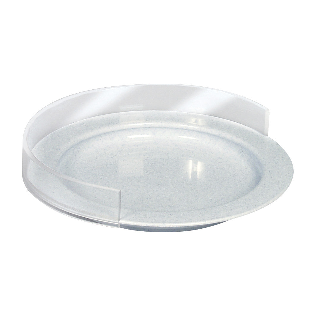 A white therafin plate guard with a semi-circular transparent barrier designed to prevent food from spilling off a round plate.