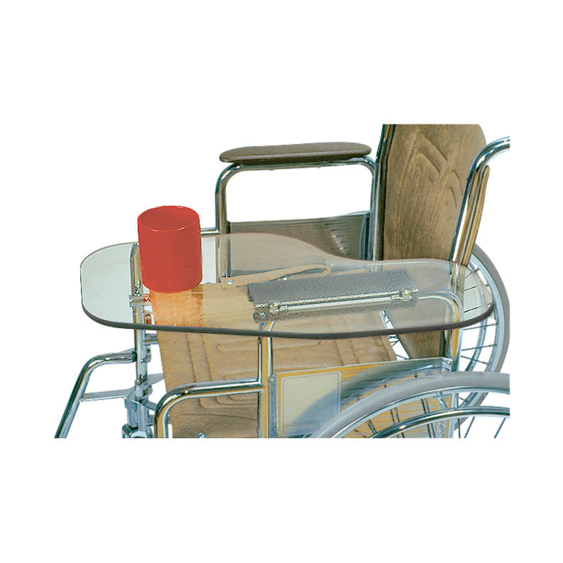 A Therafin Transparent Flip-Away Arm Support is attached to a wheelchair, with a red mug placed on it.