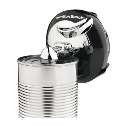The Walk and Cut Cordless Can Opener is shown in use, automatically opening a metal can with its sleek, compact design.