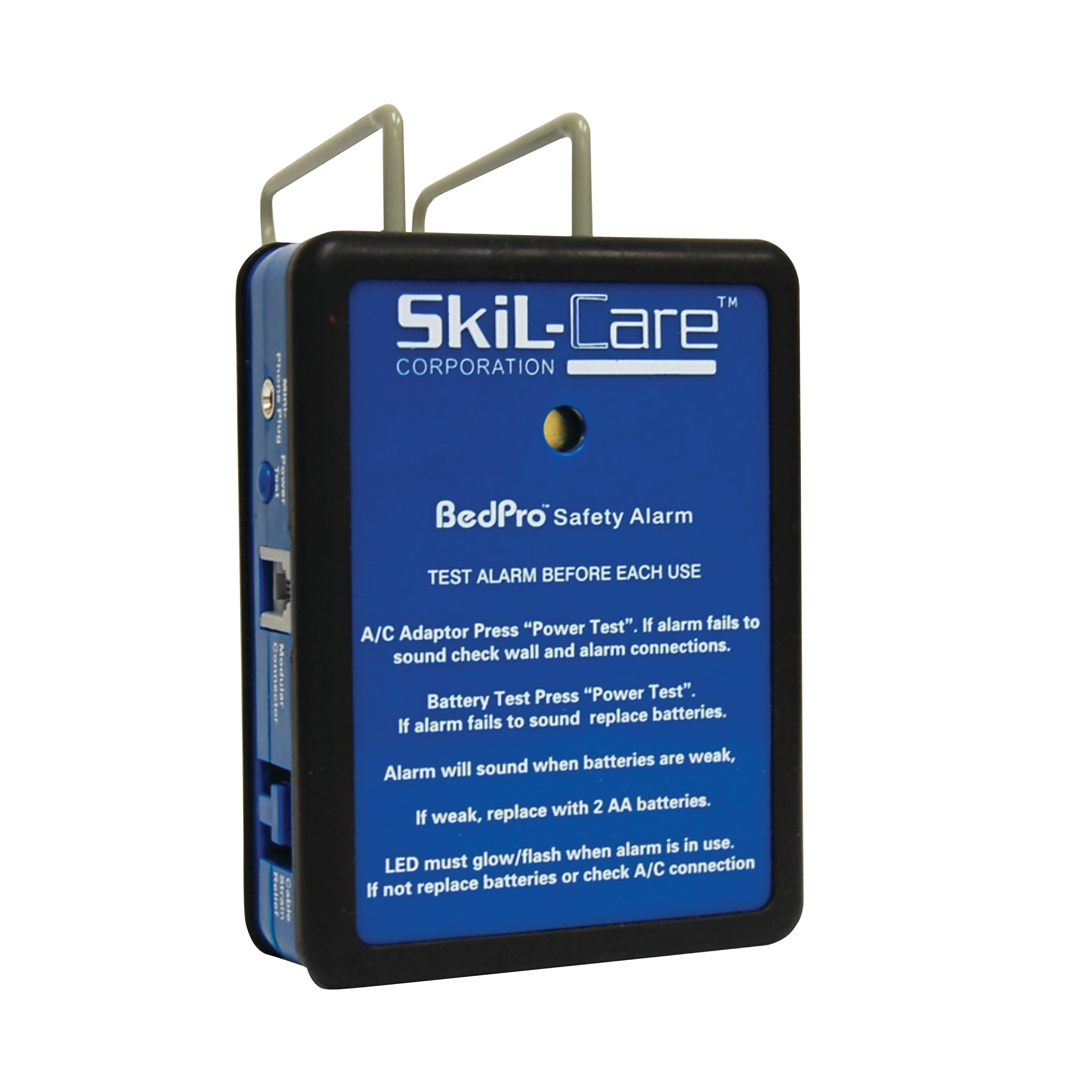 SkiL-Care BedPro Safety Alarm System with a blue and black casing, featuring instructions for testing and battery replacement.