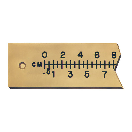 The Flexible Radiopaque Extremity Ruler is a beige ruler marked in centimeters and millimeters with a hole on one end.