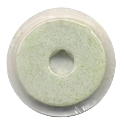 A multi-modality PET/nuclear medicine marker with a pale green sponge-like center and a circular transparent outer layer.
