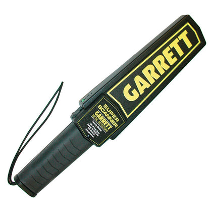 A Garrett Super Scanner Metal Detector with a logo in large yellow letters and a black handle with a wrist strap.