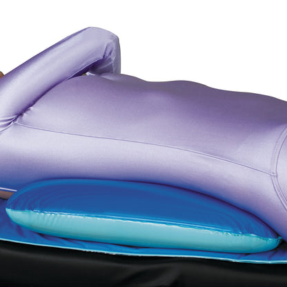 Person lying on a blue Azure Universal Patient Positioner, wearing a purple garment, demonstrating support and comfort.