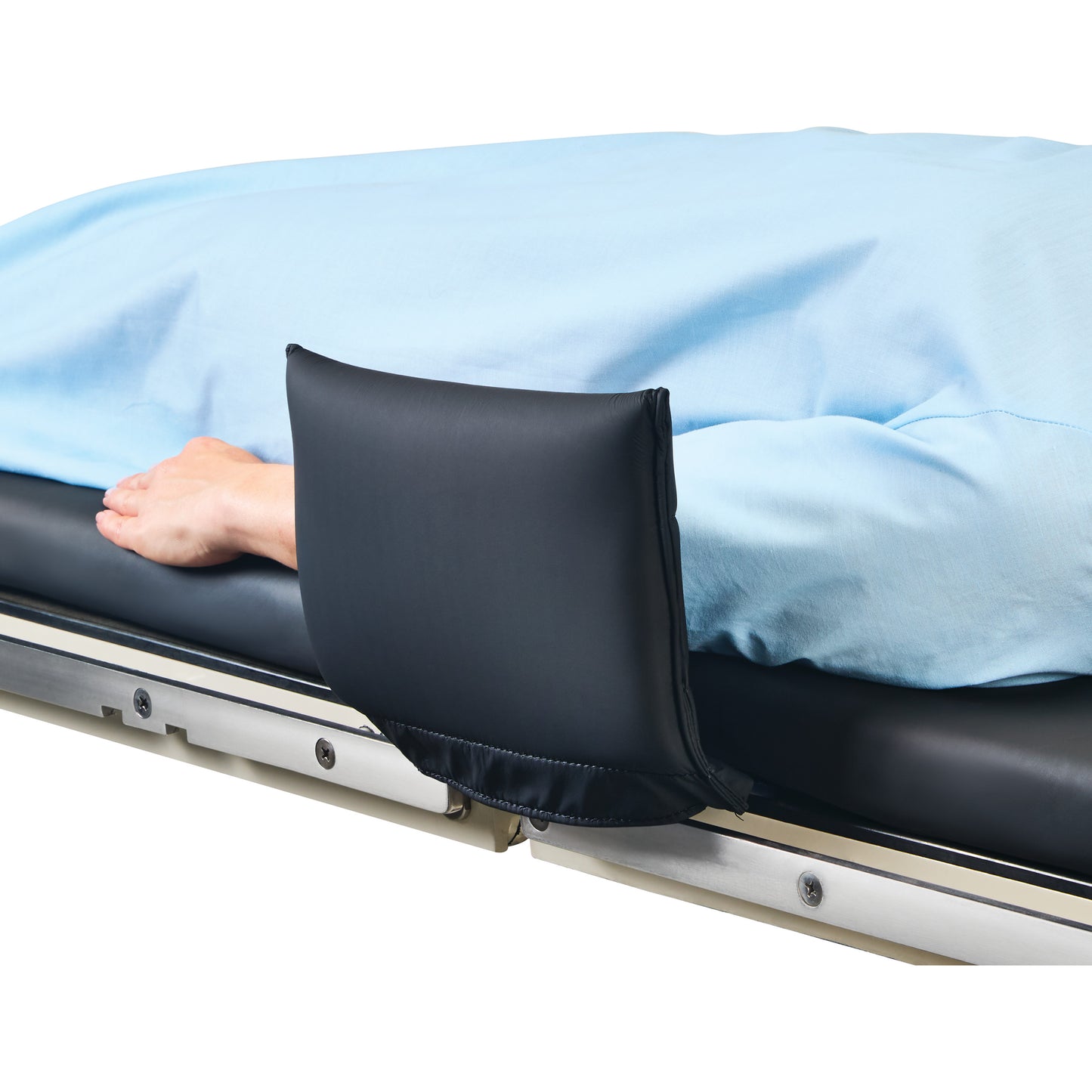 A hand rests on a bed with an "AliMed Padded Toboggan Cover" in black, attached to the bed's side rail, ensuring comfort.