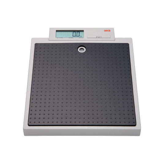 The seca 876 Digital Flat Scale features a rectangular platform with a textured black surface and an electronic digital display.