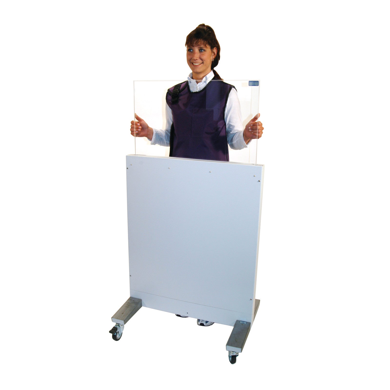 A person stands behind a RayShield Adjust-A-Height Barrier, which is a wheeled protective panel with a transparent upper section.