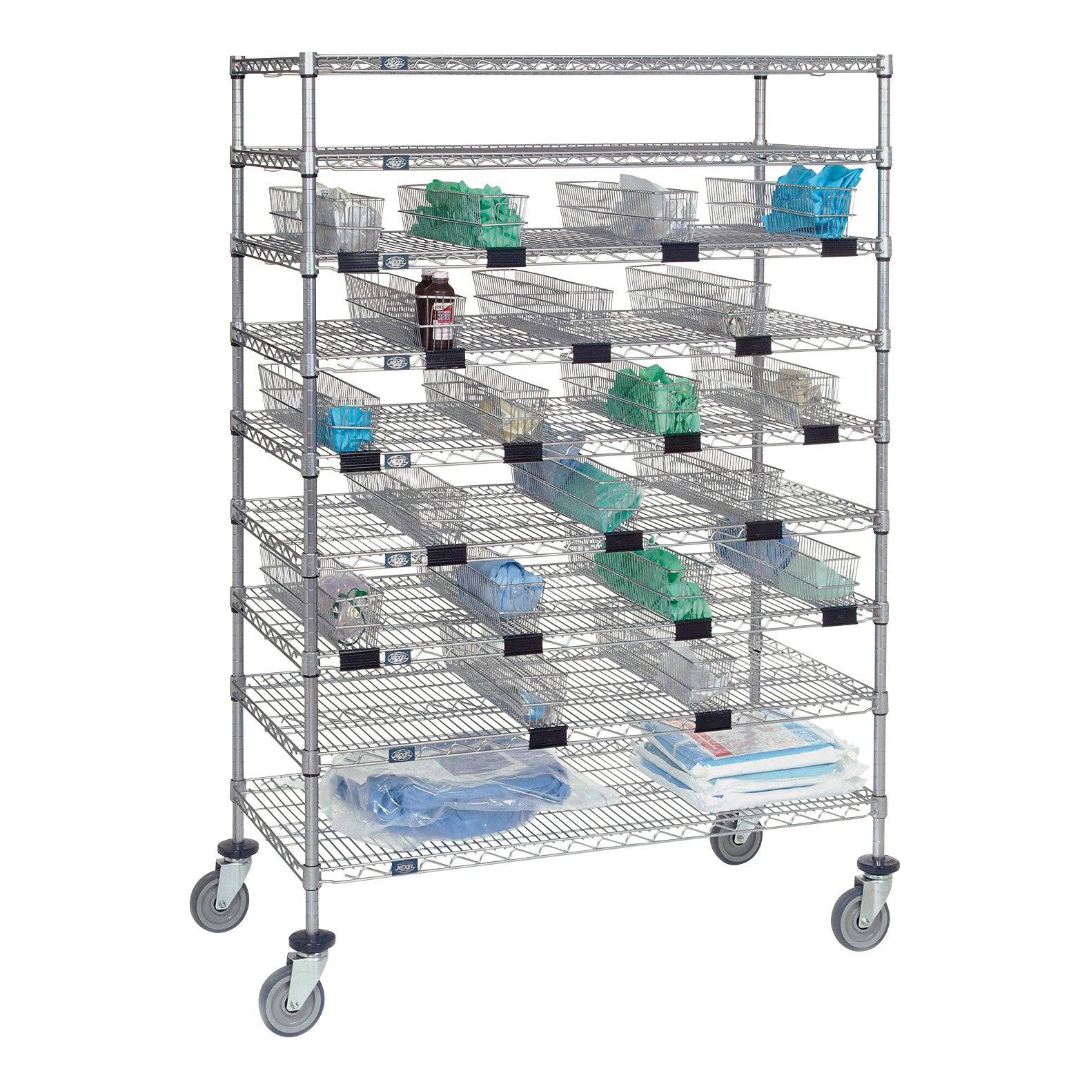 A Nexel Catheter Cart with multiple shelves holds wire baskets containing medical supplies, set on wheels for easy mobility.