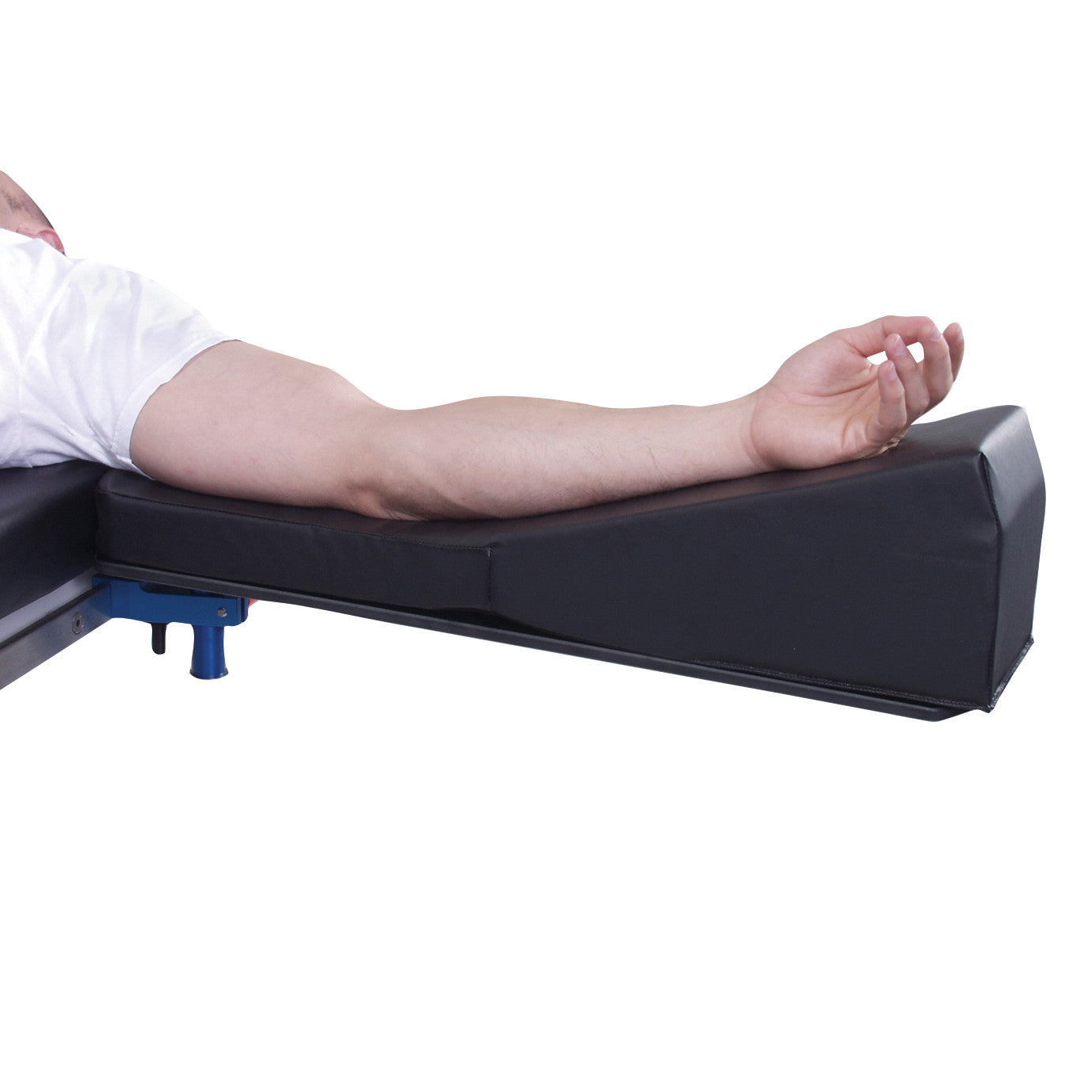 A person's arm rests on the AliMed Incline Armboard Cushion, a black cushion designed for comfortable arm support.