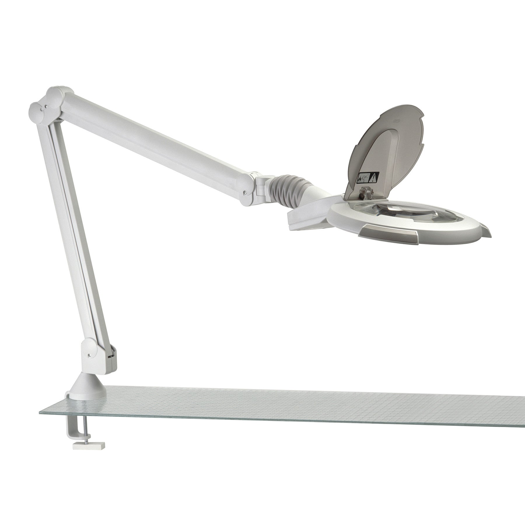 The Burton EPIC LED Magnifier is a white adjustable lamp mounted on a desk, featuring a circular magnifying lens with a cover.