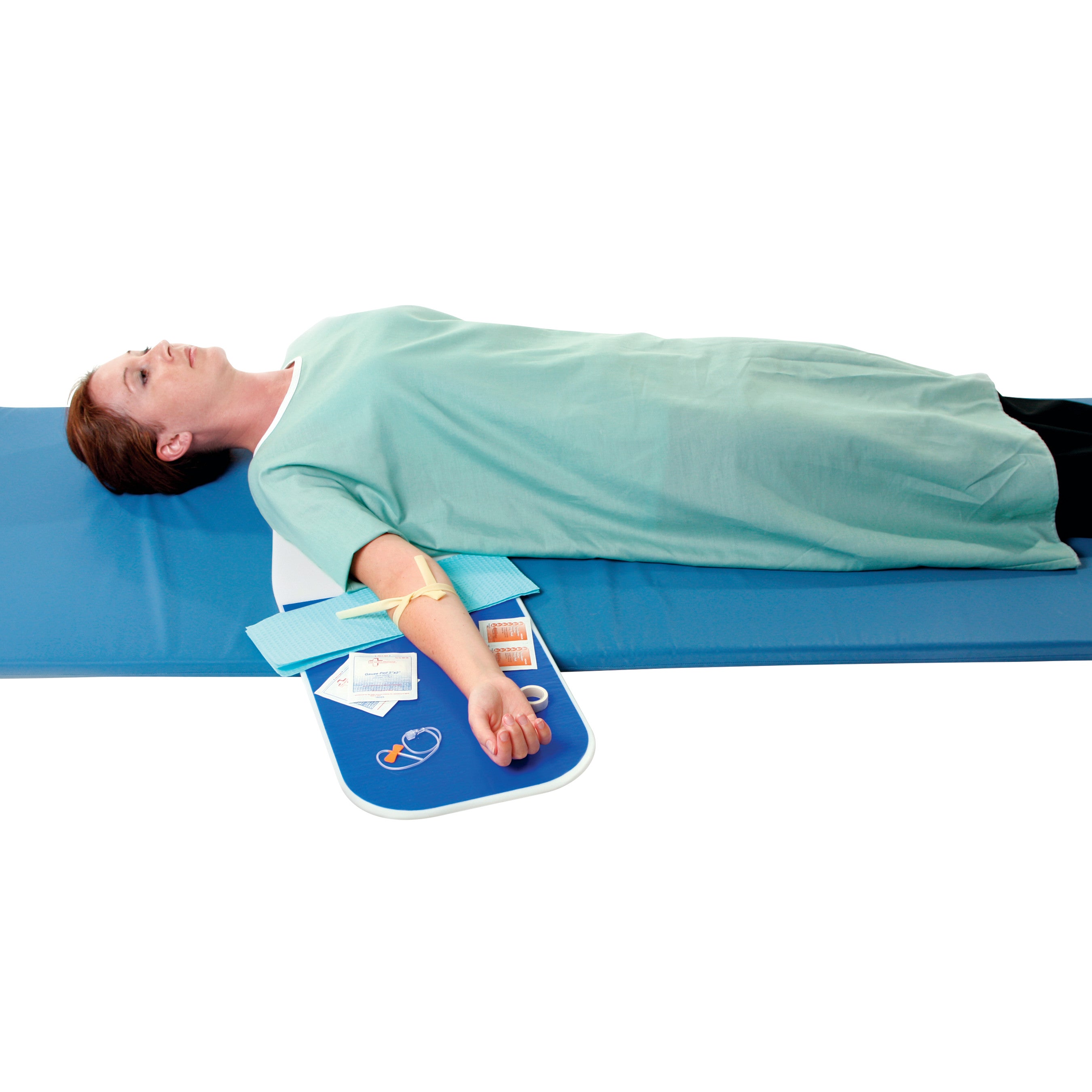 A person lies on a blue mat using an AliMed Wide Universal Armboard, which holds medical supplies next to the extended arm.