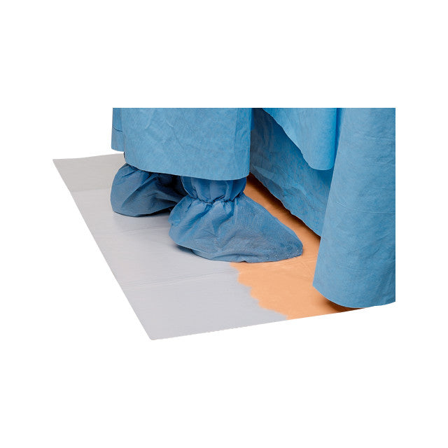Person wearing blue protective clothing stands on a SANDEL DriFloor Absorbent Pad with a dry section and an orange wet section.