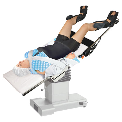A person is on an operating table using the AliMed Trendelenburg Stabilizer, with legs elevated and secured in black supports.