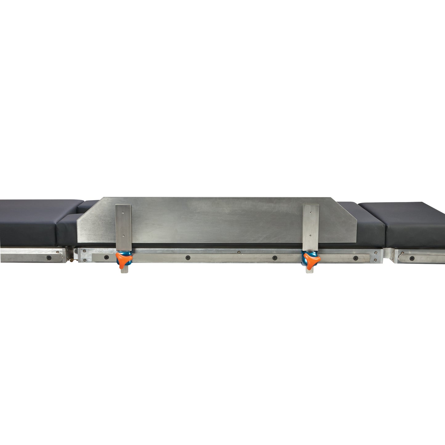 AliMed Lateral Fence on a padded medical table with metal supports and orange clamps, used for positioning during procedures.