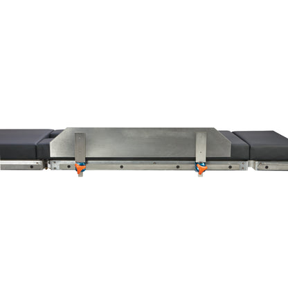 AliMed Lateral Fence on a padded medical table with metal supports and orange clamps, used for positioning during procedures.