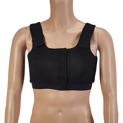 A mannequin wearing an Expand-A-Band Compression Bra with wide straps and a front opening, designed for post-surgical support.