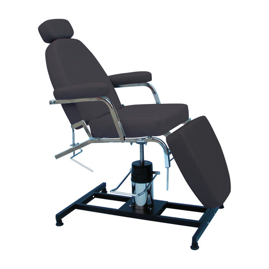 The Brandt Industries Procedure Chair is a black, adjustable chair with a reclining back, footrest, and chrome armrests on a sturdy base.