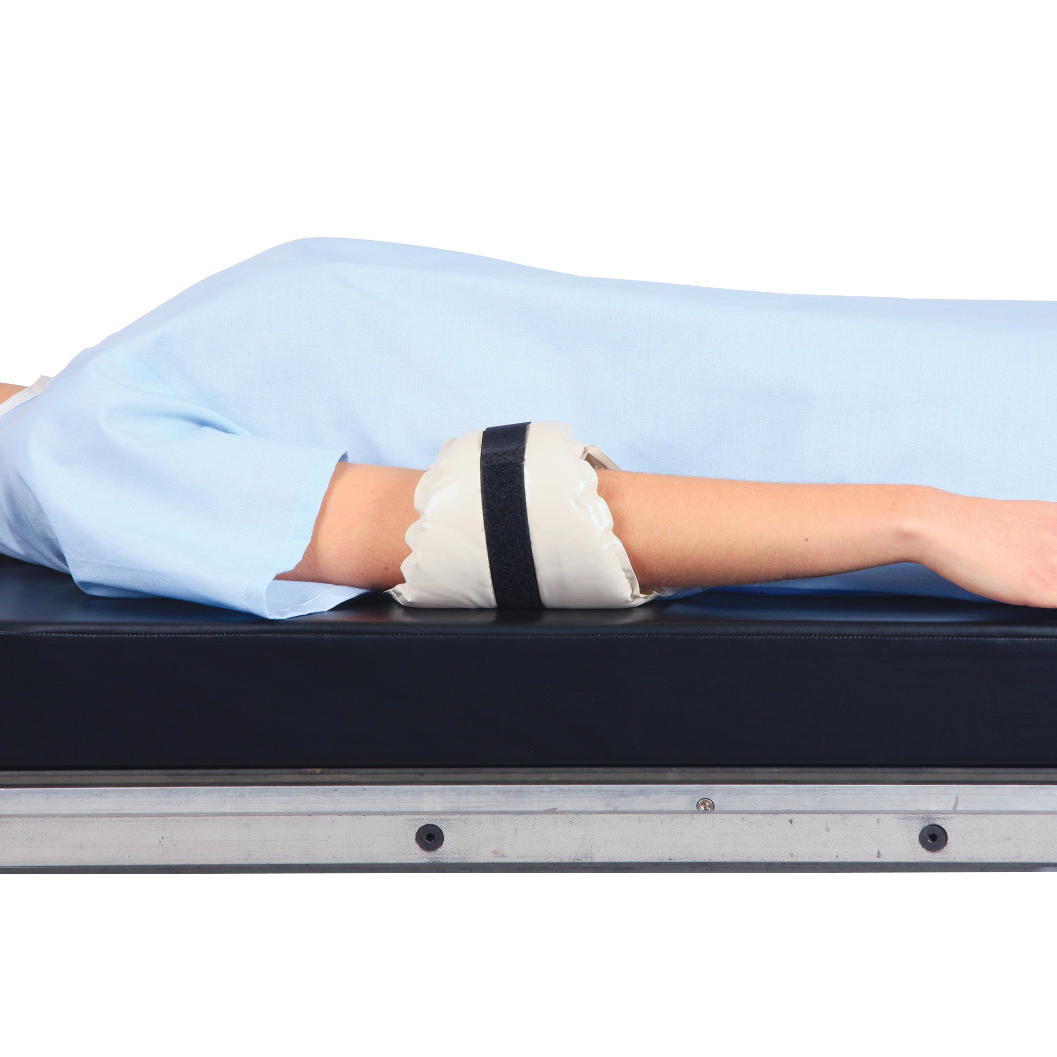 Person lying on a table with an AliMed AliGel Diamond Ulnar/Brachial Nerve Protector on their arm for support and protection.