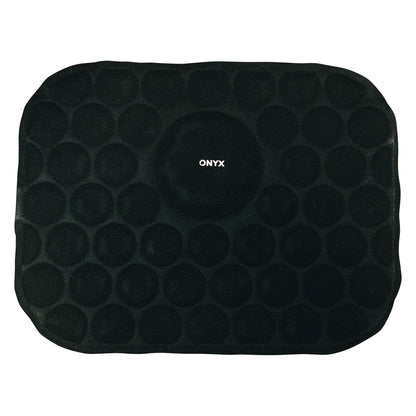 The Xena Therapies Cool Pad is a black, rectangular mat with circular patterns and "ONYX" written in the center.