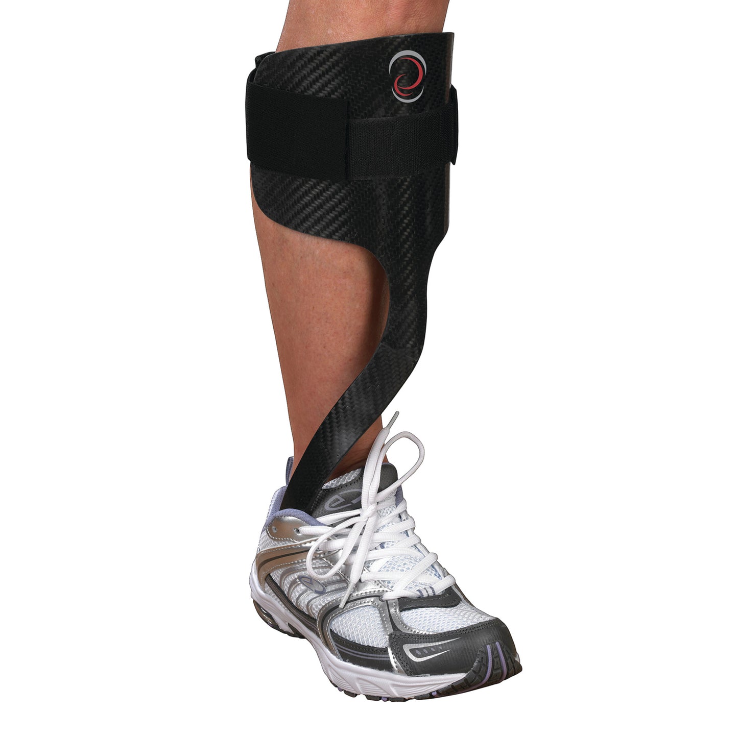 A person's leg is fitted with an Elite AFO Rehabilitator, a black carbon fiber support brace, over a white athletic shoe.