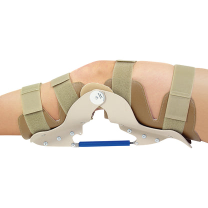 A knee wearing an AliMed Turnbuckle Knee Orthosis with beige straps and a blue turnbuckle, designed for adjustable support.