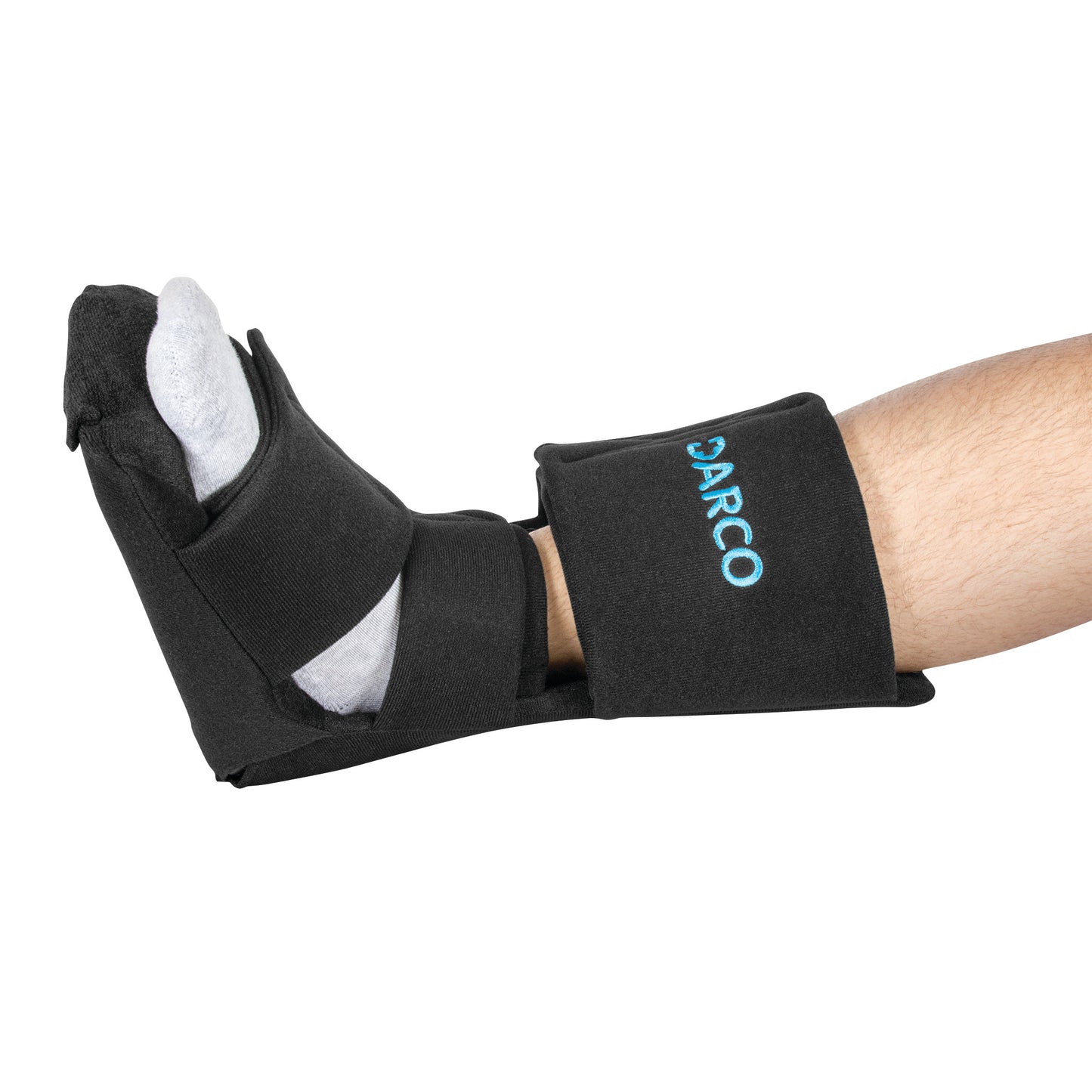 A foot wearing a DARCO Night Splint Wedge, with black straps and a sock, designed to support the foot at a right angle.