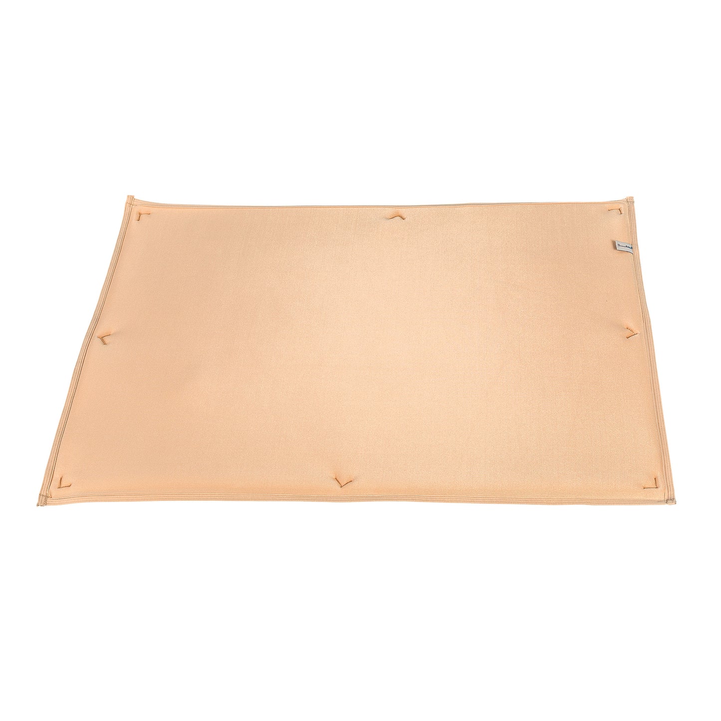 DermaSaver Pressure Reduction Pad in beige, featuring multiple stitched anchor points and a small fabric label on one edge.