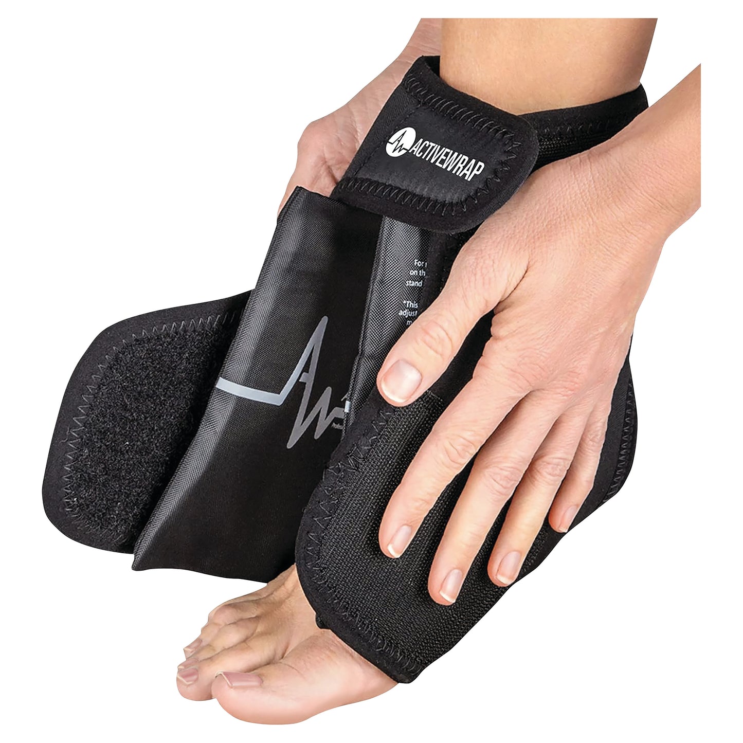 Hands are adjusting an ActiveWrap ankle support around a foot. The wrap is black with a strap.