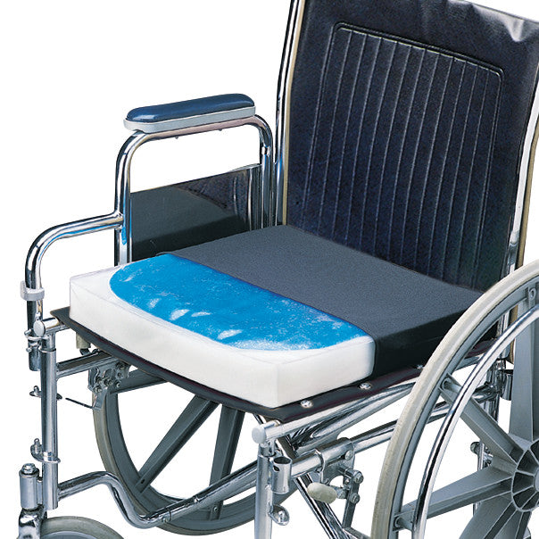 A wheelchair with a SkiL-Care Gel-Foam Wheelchair Cushion, featuring a blue gel surface and thick foam for comfort and support.