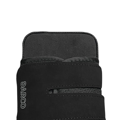 Close-up of the black DARCO OrthoWedge Shoe, showing its textured upper design with two straps and the brand logo.